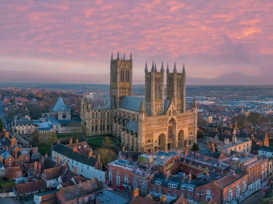 Lincoln,,Uk.,Cathedral,And,City,At,Sunset.,Aerial,View,Of
